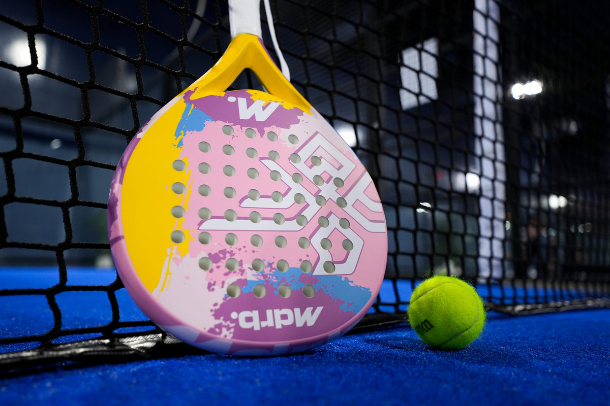 MDRB Candy Crush padel racket with a padel ball by the net