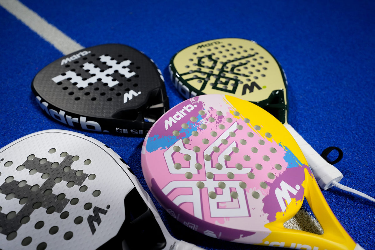 Close up of MDRB padel rackets including the Candy Crush, Vellum Ghost, Dark Matter and UAE Falcon Edition